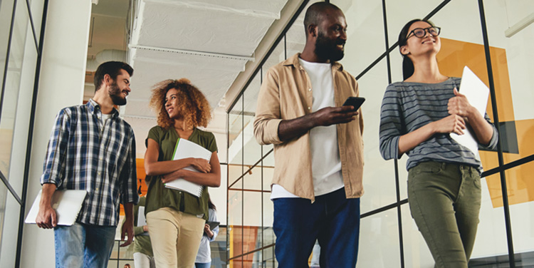 colleagues walking and talking in school