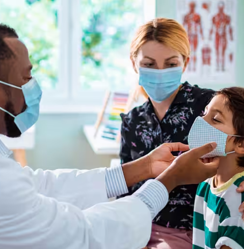 A child with his mother at the doctor's office getting a check-up