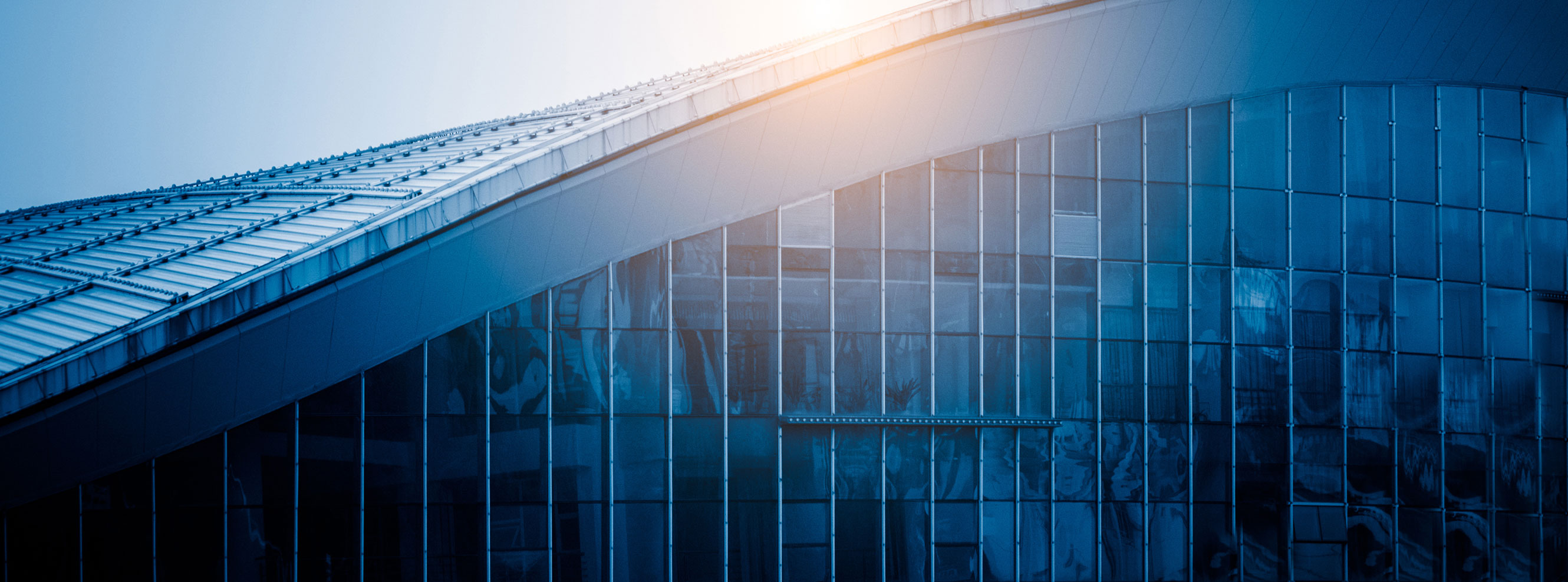 Exterior of a curved commercial building at daytime