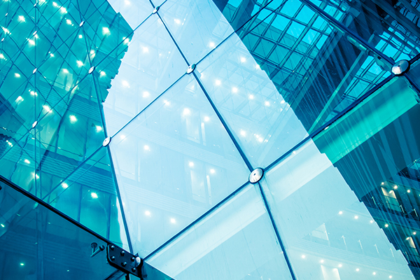Close-up of glass windows of a corporate building
