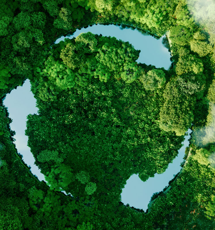 Top view of three lakes forming the recycling symbol amidst a lush forest