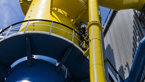 A yellow pipe with a railing