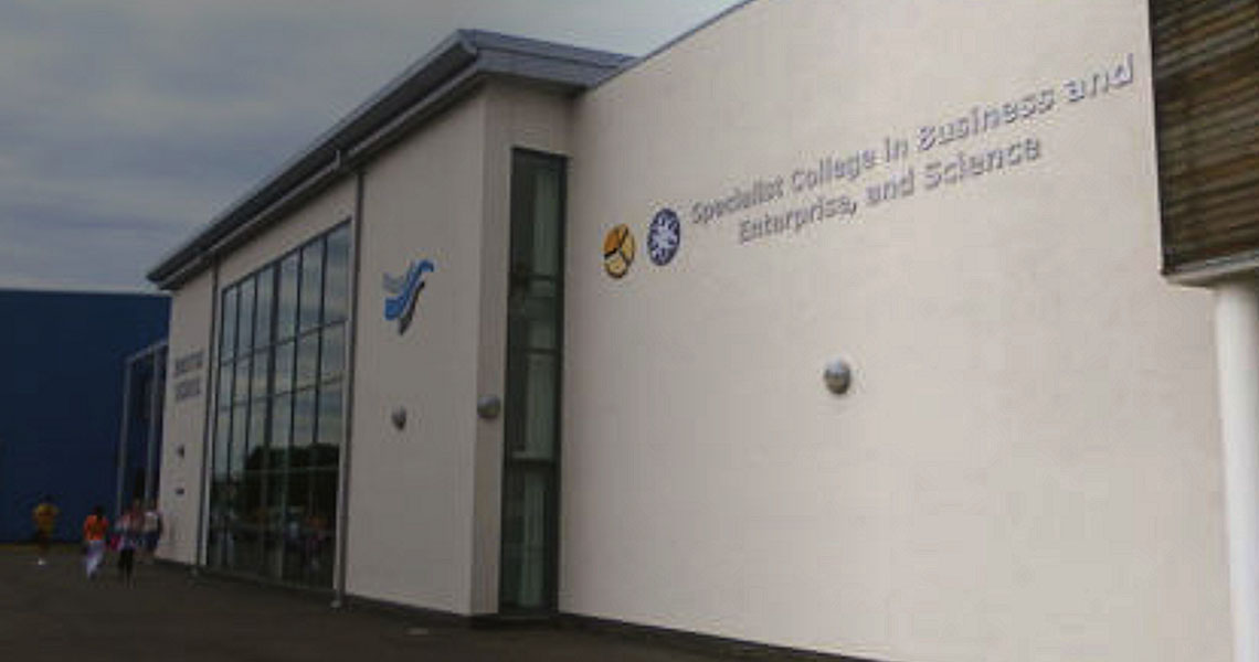 Exterior of a building with title 'Specialist College in Business and Enterprise, and Science'