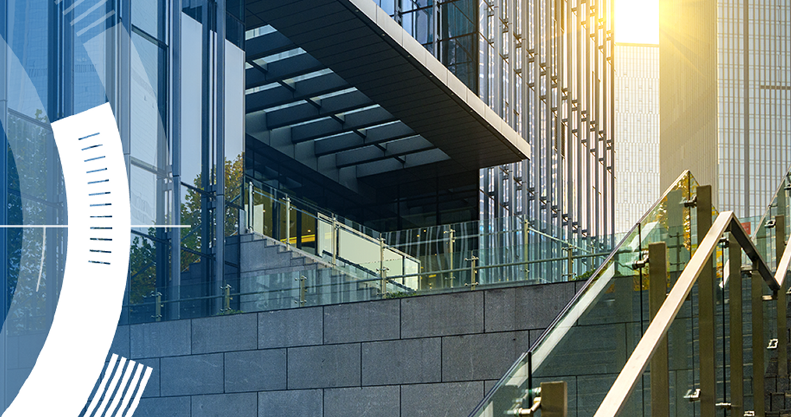 Exterior of a glass building  with semi circular graphics on one corner