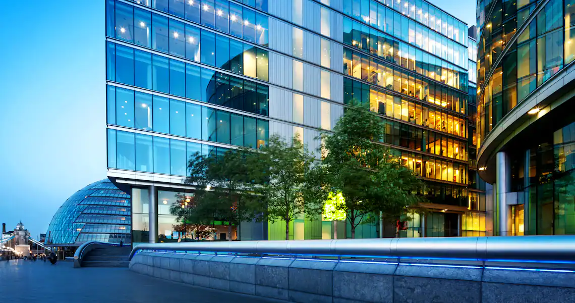Modern glass buildings with a walkway on the side