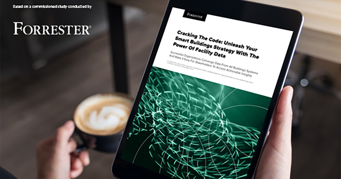 A person holding a tablet displaying a commissioned study by Forrester