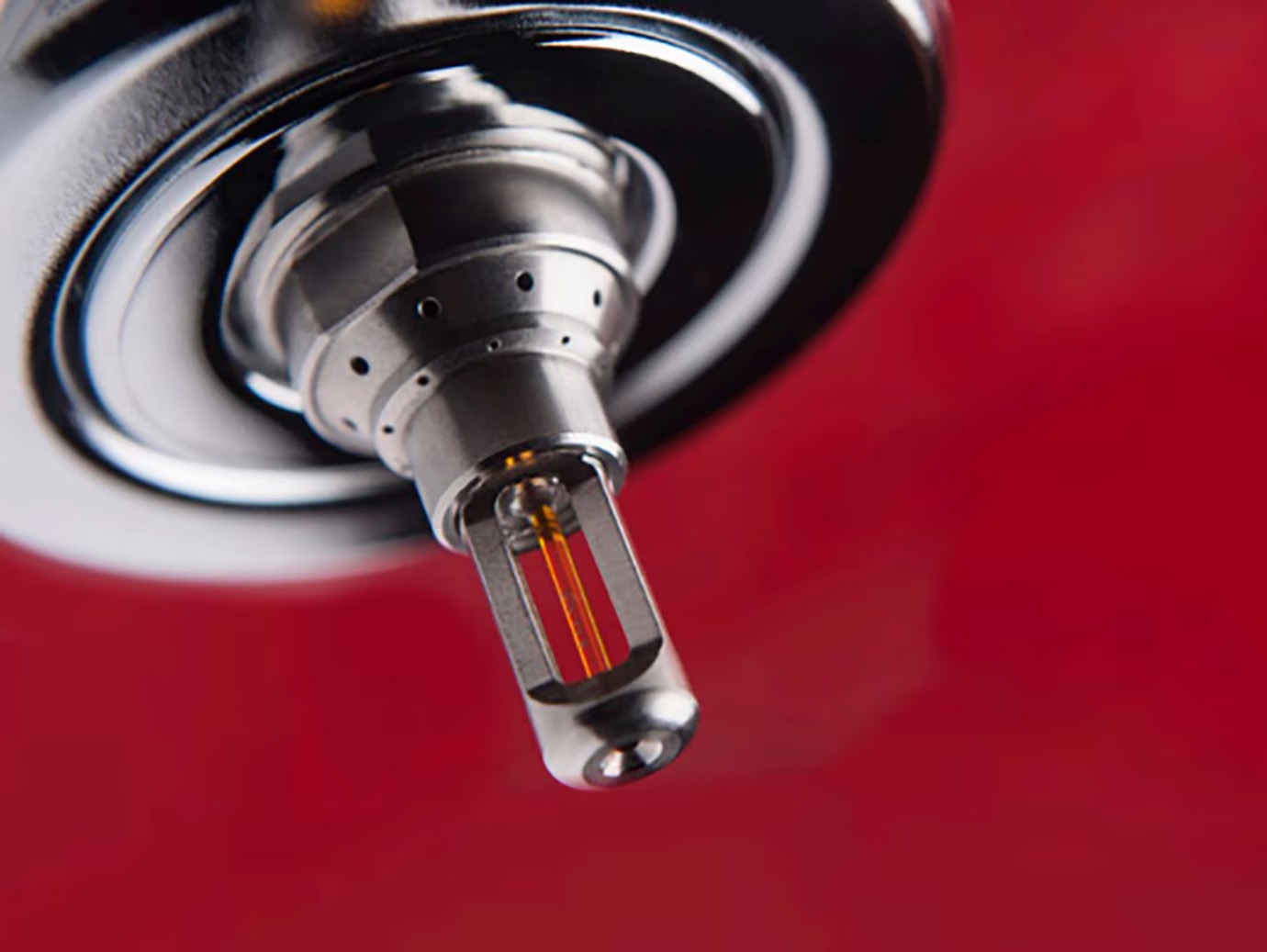 Water mist fire suppression system against a red background