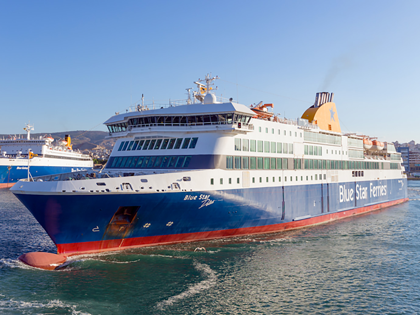 A ship from Blue Star Ferries leaving the dock