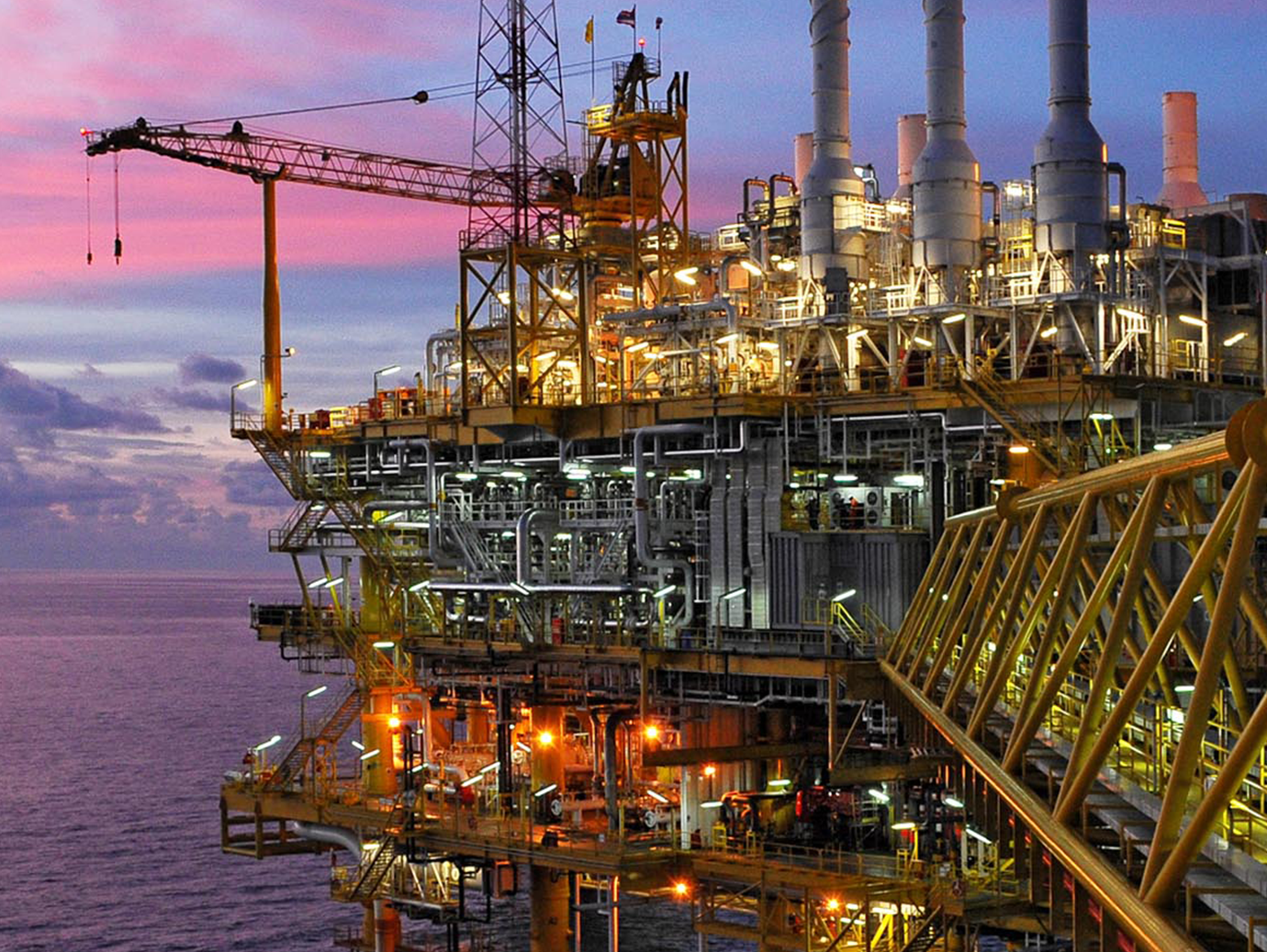 Industrial furnace and heat exchanger cracking hydrocarbons in petroleum factory on sky sunset background, Manufacturing of petrochemical plant.