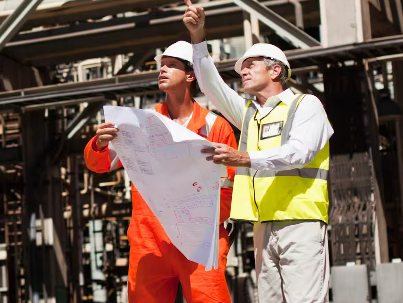 Mechanical engineer team working with paper work.