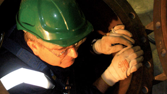 Worker climbing out confined space