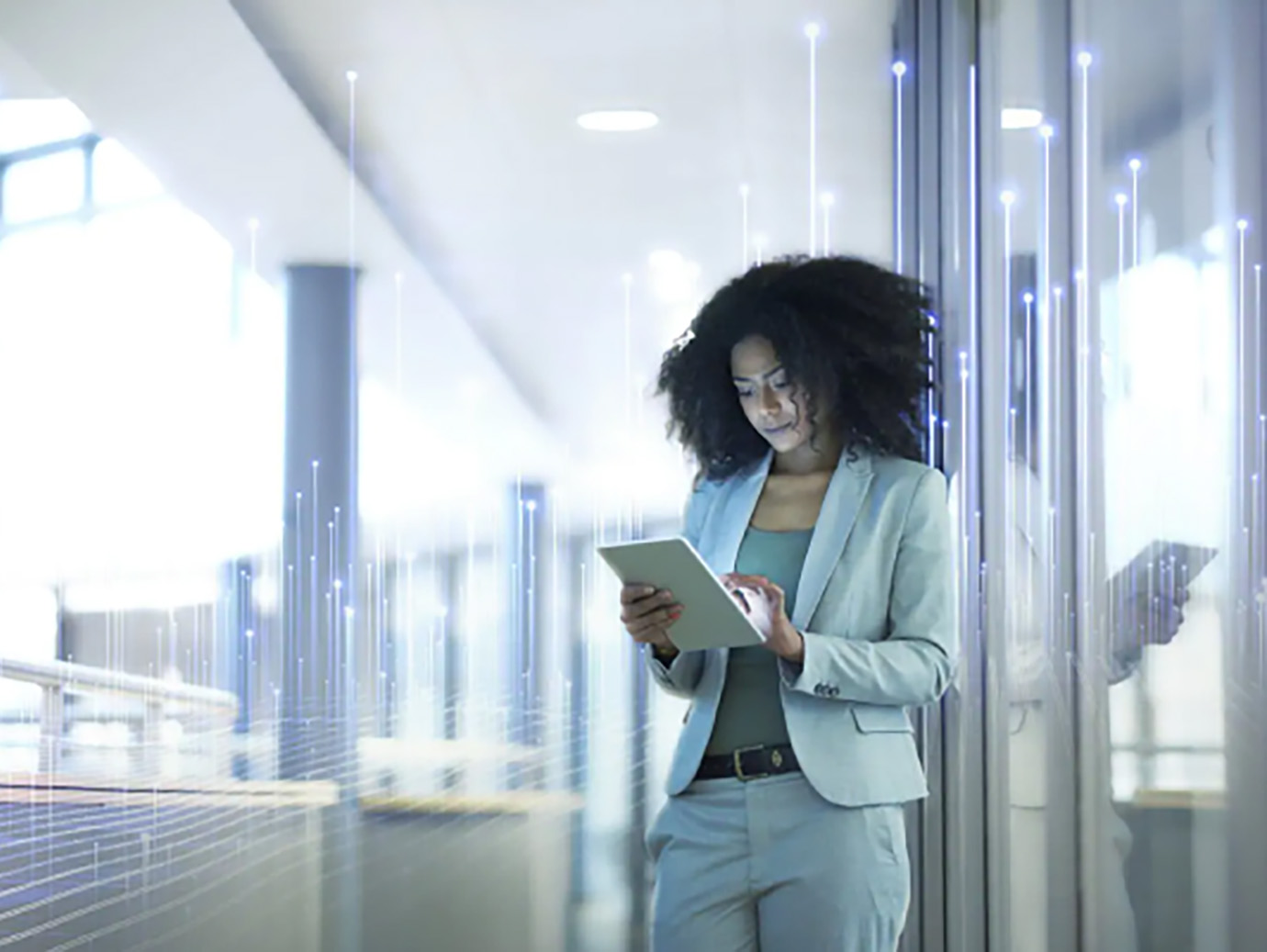 A businesswoman scrolling a tablet