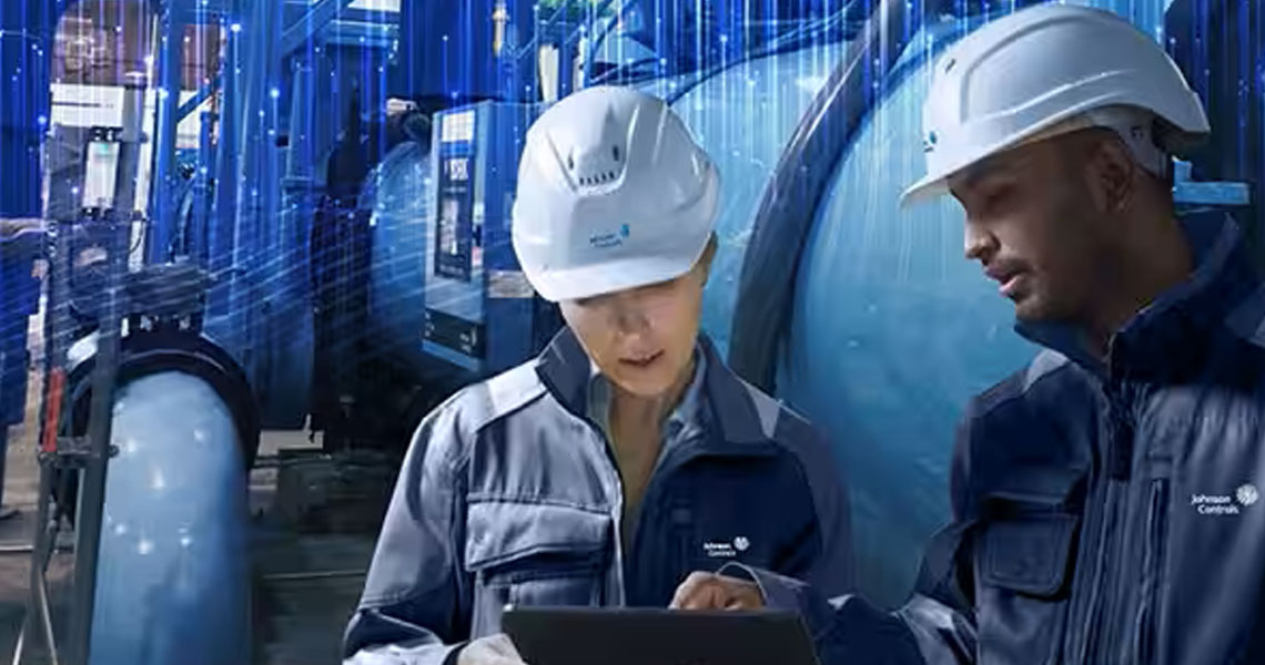 Two workers in a factory having a discussion