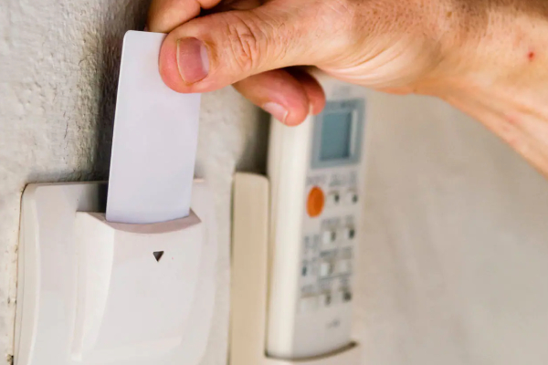 a man swiping his card in the swiping machine