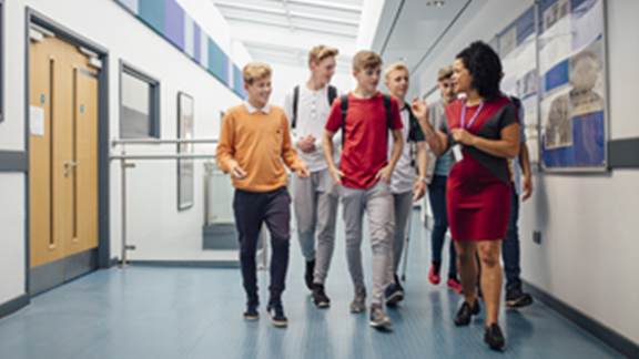 Colleague walking in office corridor