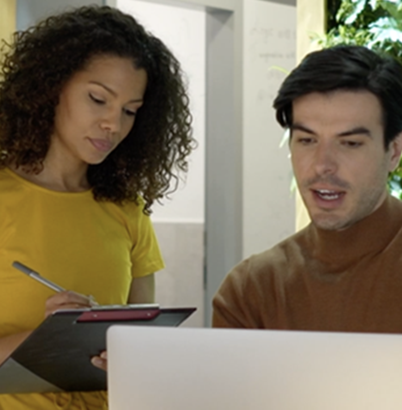 Two colleague watching laptop