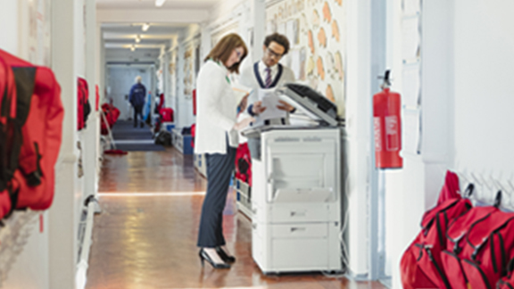 Two people doing xerox