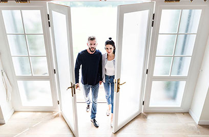 couple entering their home
