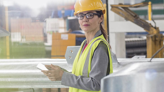 female worker with helmet tab