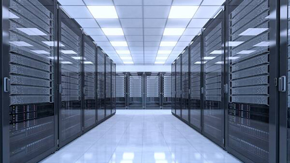 Two rows of server racks on either side in a server room