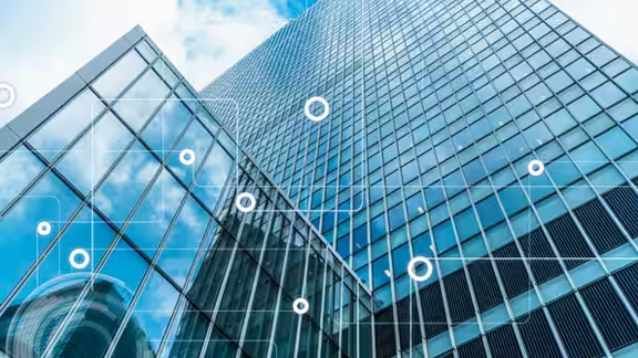 Low-angle view of a high-rise building, overlaid with a modern graphic