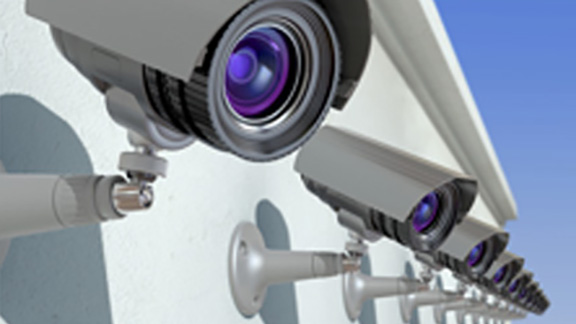 A row of CCTV cameras on a building