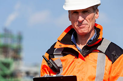 worker holding clipboard with paperwork