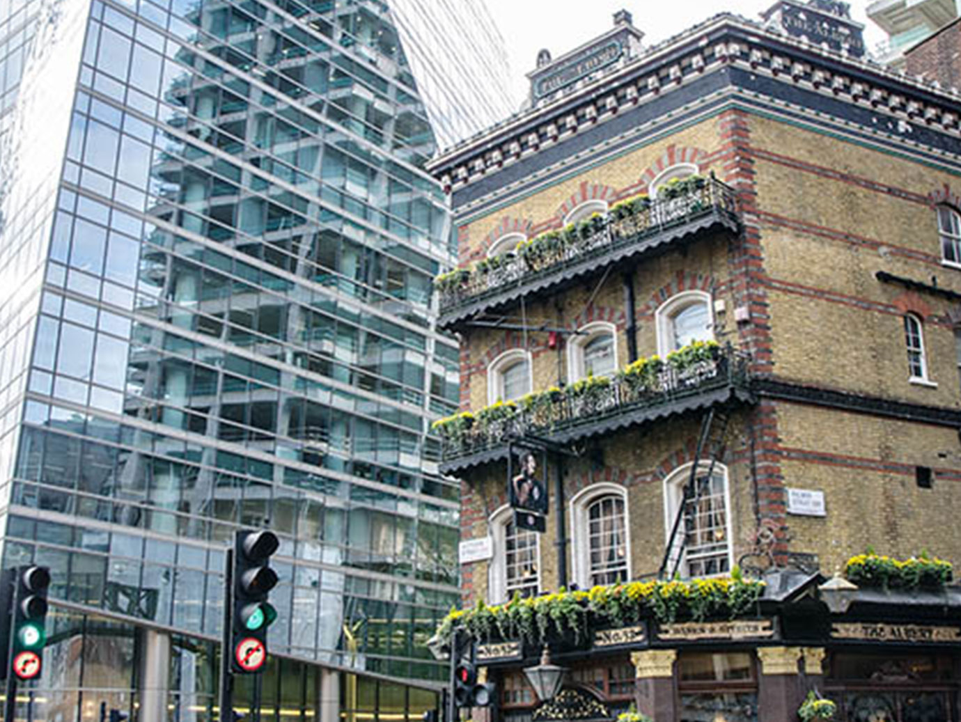 glass building next to residential building
