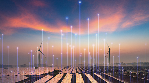 A wind turbine farm at sunset, overlaid with OpenBlue graphics