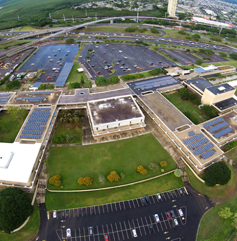 Aerial view of buildings with solar panels on the rooftops